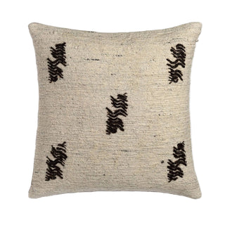 Textured pillow with black pattern on a light gray background