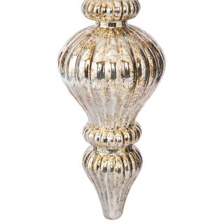 Decorative finial with gold and silver finish on a light gray background