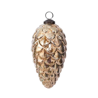 Decorative glass pinecone ornament on a light gray background