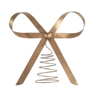 Decorative gold bow with a spiral design on a white background
