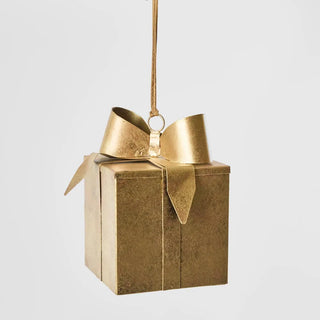 Gold gift box ornament with a bow on a white background