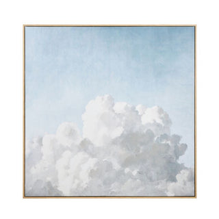 Framed artwork of a cloud against a light blue sky