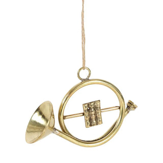 Decorative gold wind chime with circular design on a white background