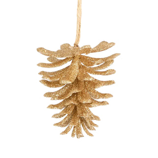 Gold glittery pine cone ornament on a white background