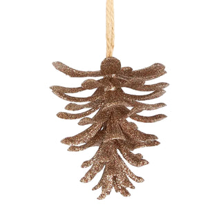 Gold glittery pine cone ornament on a white background