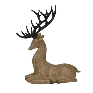 Decorative deer figurine with black antlers on a light gray background