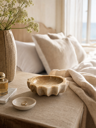 Beige marble scalloped bowl styled on bedside table - Gray & Co