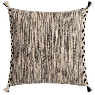 Textured pillow with black and white pattern on a light gray background