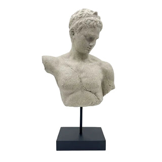 Stone bust of a classical figure on a black stand against a white background