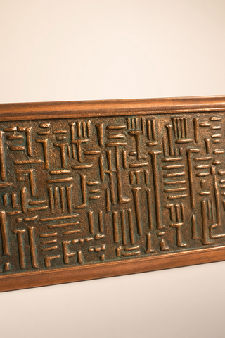 Close up of the hammered brass side detailing on the Lador Switzerland musical jewellery box