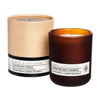 Scented soy candle with packaging on a white background