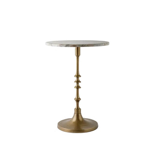 Small round marble-top table with a brass base on a white background