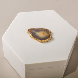 Close up of the polished agate gemstone lid accent with gold edging on the Topaz decorative box
