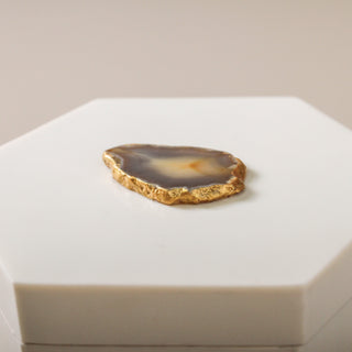 Detail view of the natural agate stone veining and gold leaf edge on the Topaz decorative box lid